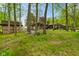 Wooded exterior view of a cozy home with a deck and mature trees at 12142 N Paddock Rd, Camby, IN 46113