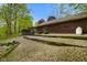 Rustic exterior of the house with gravel landscaping and wooden accents at 12142 N Paddock Rd, Camby, IN 46113