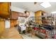 Functional garage workspace with shelving, sink, and overhead cabinets for storage at 12142 N Paddock Rd, Camby, IN 46113