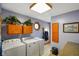Bright laundry room featuring modern appliances, ample storage, and stylish decor at 12142 N Paddock Rd, Camby, IN 46113