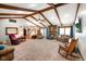 Inviting living room with exposed ceiling beams, fireplace, and lots of space at 12142 N Paddock Rd, Camby, IN 46113