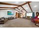 Open living room with fireplace, large TV, and lots of natural light at 12142 N Paddock Rd, Camby, IN 46113