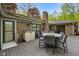 Outdoor patio features a dining set, brick chimney, and beautiful backyard views at 12142 N Paddock Rd, Camby, IN 46113