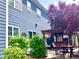 Charming backyard featuring a wooden pergola, hot tub, patio seating, and lush green landscaping at 13766 Heatherfield Dr, Fishers, IN 46038