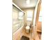 Well-lit bathroom featuring a glass-enclosed shower and standard toilet with a tiled floor at 13766 Heatherfield Dr, Fishers, IN 46038