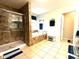 Bright bathroom with a marble walk-in shower and a soaking tub with marble surround at 13766 Heatherfield Dr, Fishers, IN 46038