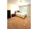 Cozy bedroom with a comfortable bed, a nightstand, a dresser, and a window at 13766 Heatherfield Dr, Fishers, IN 46038