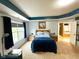 Primary bedroom featuring a blue accent, a king bed and large window for natural light at 13766 Heatherfield Dr, Fishers, IN 46038