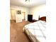 Bedroom with a queen bed, a dresser, and an open door to a walk-in closet at 13766 Heatherfield Dr, Fishers, IN 46038