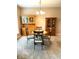 Dining room with a round table, four chairs, and two wooden display cabinets at 13766 Heatherfield Dr, Fishers, IN 46038