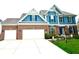 Charming home featuring a three-car garage and beautiful landscaping at 13766 Heatherfield Dr, Fishers, IN 46038