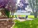 Backyard fire pit and seating area surrounded by lush greenery that offers relaxation at 13766 Heatherfield Dr, Fishers, IN 46038
