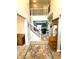 Grand foyer with soaring ceilings, wrought iron staircase, and wood floors at 13766 Heatherfield Dr, Fishers, IN 46038