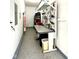 Organized garage featuring a well-equipped workbench and epoxy floor, perfect for DIY projects and storage at 13766 Heatherfield Dr, Fishers, IN 46038