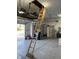 Spacious garage with epoxy flooring, a pull-down attic ladder, and ample storage space at 13766 Heatherfield Dr, Fishers, IN 46038