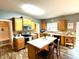 Bright kitchen featuring wood cabinets, stainless steel appliances, and a breakfast bar at 13766 Heatherfield Dr, Fishers, IN 46038