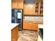 Modern kitchen featuring stainless steel appliances, wooden cabinets, and stylish backsplash at 13766 Heatherfield Dr, Fishers, IN 46038