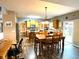 Bright kitchen with wood cabinets, center island, stainless steel appliances, and dining area at 13766 Heatherfield Dr, Fishers, IN 46038