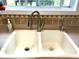 Double basin kitchen sink features a modern faucet and tiled backsplash at 13766 Heatherfield Dr, Fishers, IN 46038