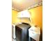 Laundry room with a front load washer and dryer, cabinets, and a utility sink at 13766 Heatherfield Dr, Fishers, IN 46038