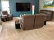 Spacious living room with plush recliners, cozy carpet, contemporary lighting, and mounted TV at 13766 Heatherfield Dr, Fishers, IN 46038