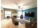 Cozy living room featuring a fireplace, plush seating, and a large TV at 13766 Heatherfield Dr, Fishers, IN 46038