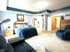 Large main bedroom with sitting area, king bed, and two entrances to an ensuite bathroom at 13766 Heatherfield Dr, Fishers, IN 46038
