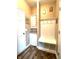Well-organized mudroom with built-in bench seating, storage cubbies, and decorative wall art at 13766 Heatherfield Dr, Fishers, IN 46038