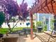 Outdoor patio with a grill, table, and lush surroundings that offers relaxation at 13766 Heatherfield Dr, Fishers, IN 46038
