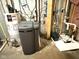 Basement utility room with water heater, water softener, and essential home systems at 13766 Heatherfield Dr, Fishers, IN 46038