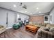 Finished basement with a cozy sitting area, home office space, and a plaid sectional sofa at 1416 Wellington Ave, Indianapolis, IN 46219