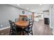Bright dining room features fireplace and open floorplan to the kitchen at 1416 Wellington Ave, Indianapolis, IN 46219