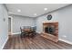 This dining room features a brick fireplace and a dining table at 1416 Wellington Ave, Indianapolis, IN 46219