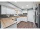 Renovated kitchen featuring white cabinets and stainless steel appliances at 1416 Wellington Ave, Indianapolis, IN 46219