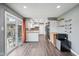 Bright kitchen with stainless appliances and view to backyard through sliding doors at 1416 Wellington Ave, Indianapolis, IN 46219