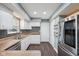 Bright kitchen featuring stainless steel appliances, stylish backsplash and white cabinets at 1416 Wellington Ave, Indianapolis, IN 46219
