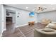 Inviting living room featuring wood floors, ceiling fan, and recessed lights, perfect for relaxing and entertaining at 1416 Wellington Ave, Indianapolis, IN 46219