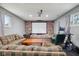Finished basement with brick wall, plush seating, workout bike and media space at 1416 Wellington Ave, Indianapolis, IN 46219