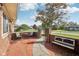 View of outdoor patio with seating area on a brick-paved ground and privacy fence at 1416 Wellington Ave, Indianapolis, IN 46219