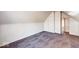 Slanted bedroom featuring neutral walls, carpet, and doorways leading to other rooms at 1425 S Belmont Ave, Indianapolis, IN 46221