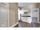 Functional kitchen space with updated cabinets and a view into an adjacent room at 1425 S Belmont Ave, Indianapolis, IN 46221
