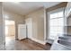 Practical kitchen layout, featuring a refrigerator, storage, and a view into adjacent rooms at 1425 S Belmont Ave, Indianapolis, IN 46221
