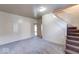 Comfortable living room featuring new carpet and a staircase to the upper level at 1425 S Belmont Ave, Indianapolis, IN 46221