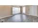 Bright living room with large windows, fresh paint, and new flooring at 1425 S Belmont Ave, Indianapolis, IN 46221