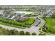 Aerial view of a community and pond with a fountain, and a truck arriving to the community at 14878 Anees Ln, Fishers, IN 46040