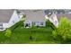 Aerial view of a fenced backyard with a lush lawn and outdoor living space at 14878 Anees Ln, Fishers, IN 46040