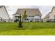 Well-maintained backyard with green grass and black wrought iron fencing at 14878 Anees Ln, Fishers, IN 46040