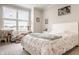 Bright bedroom featuring a cozy bed, cat tree, and ample natural light from the large window at 14878 Anees Ln, Fishers, IN 46040