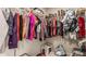 Walk-in closet with organized hanging racks, providing ample storage space for clothes and accessories at 14878 Anees Ln, Fishers, IN 46040