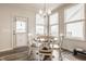 Cozy dining area with a round table, white chairs, and natural light, ideal for meals at 14878 Anees Ln, Fishers, IN 46040